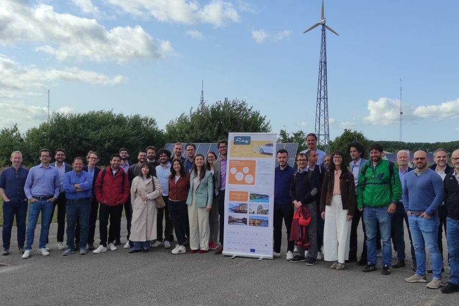 Participants of the FLOW project gathered at an energy infrastructure site during a project meeting.